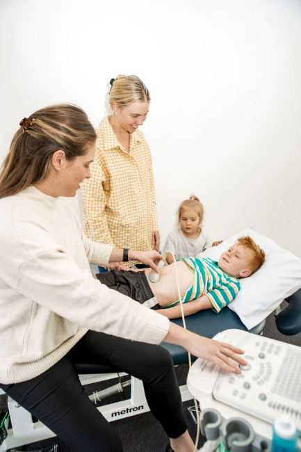 Child getting abdominal ultrasound