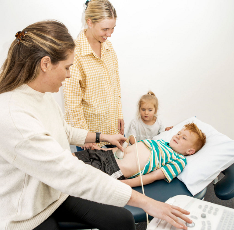 Child getting abdominal ultrasound